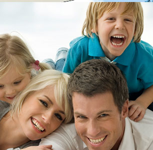 A family smiling for the camera in Toowoomba